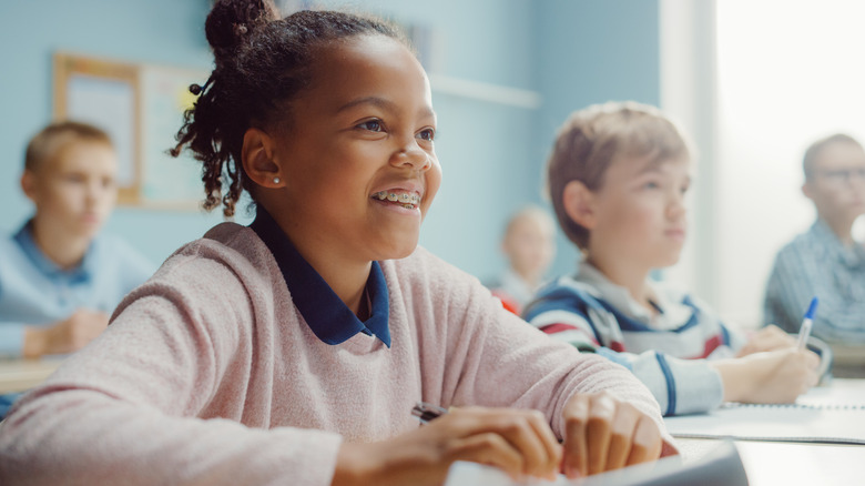 Girl and boy with ADHD in classroom