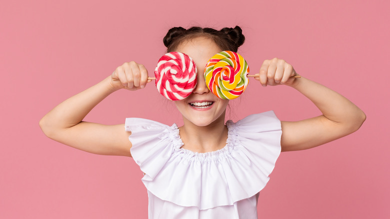 Girl with two lollipops