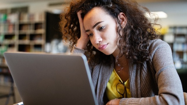 Curly-haired girl struggling to focus