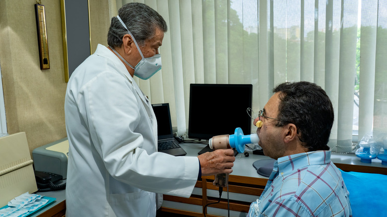 doctor with patient spirometer