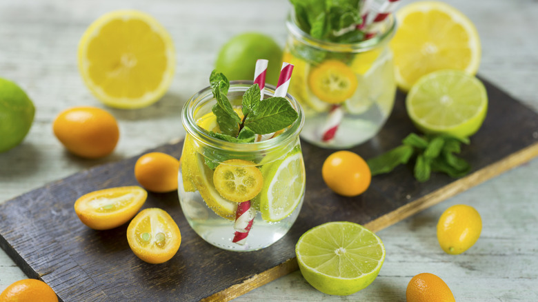 glasses of water infused with lemon, lime, and mint