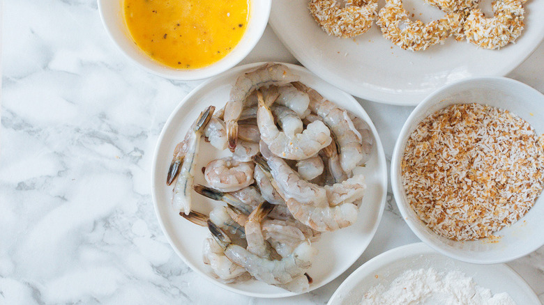 shrimp and coating ingredients in bowls