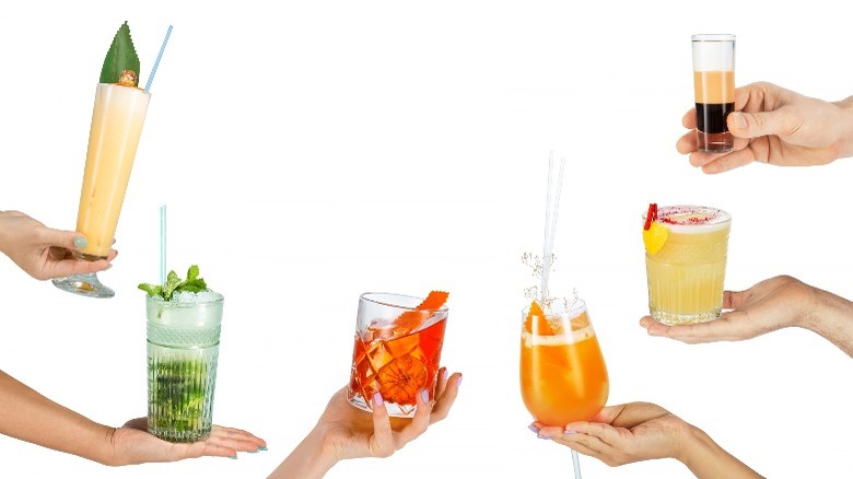 six different cocktail drinks (held in hands)