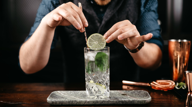 bartender preparing vodka soda