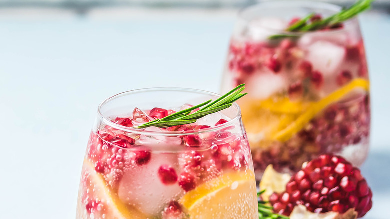 Wine spritzer with fruit and ice cubes