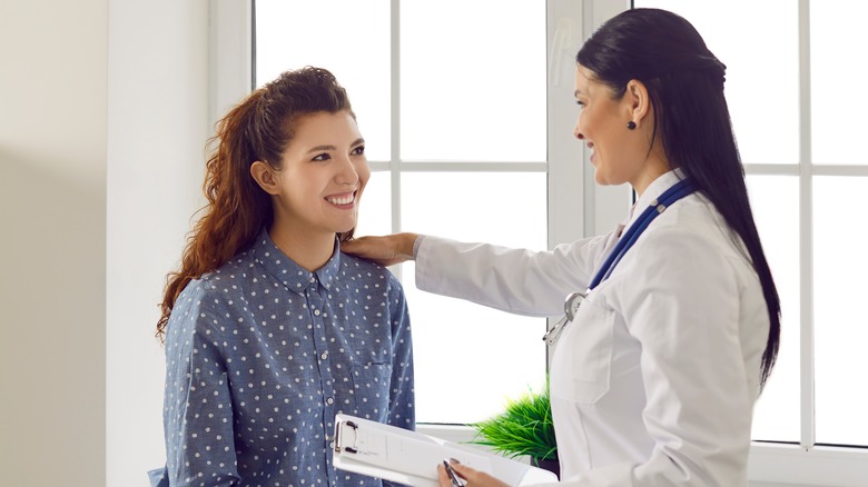 woman talking to female doctor