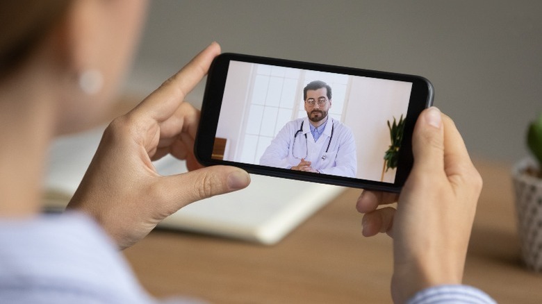 Man video chats with therapist