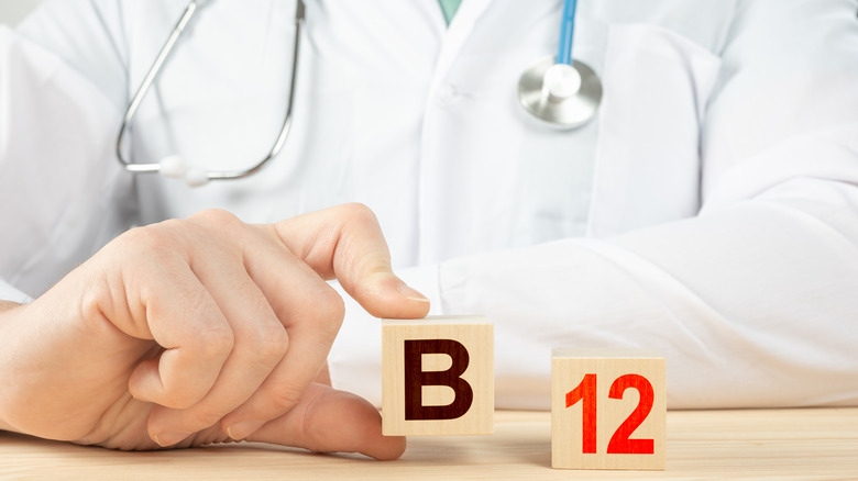 doctor with toy blocks that spell B12