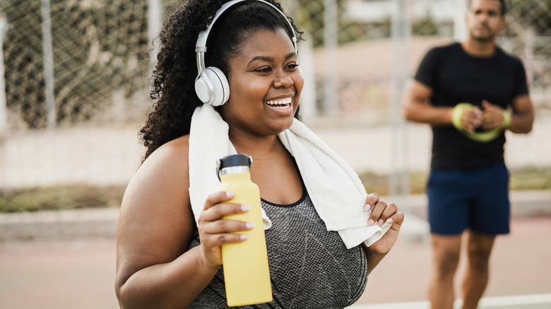 woman smiling during exercise break