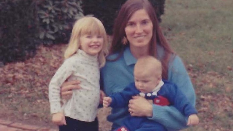 Allyn Rose smiling with her mother and sibling