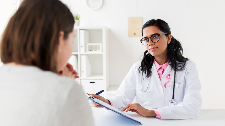 Nervous woman talking to doctor