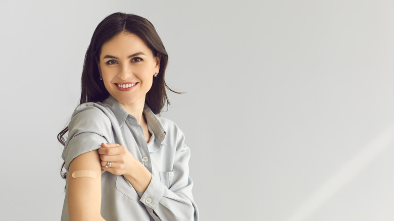 Woman smiling after getting a vaccine