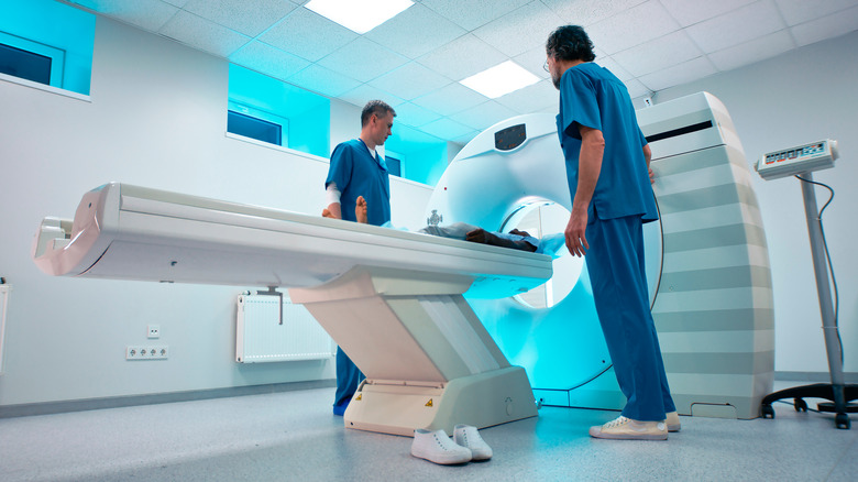 Doctors performing CT scan