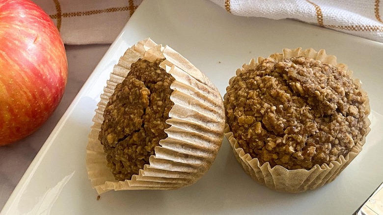 Two muffins sitting on a plate