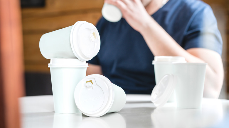 empty white cups displaying a caffeine addiction concept 