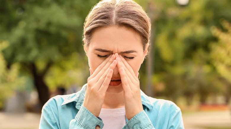 woman experiencing seasonal allergies