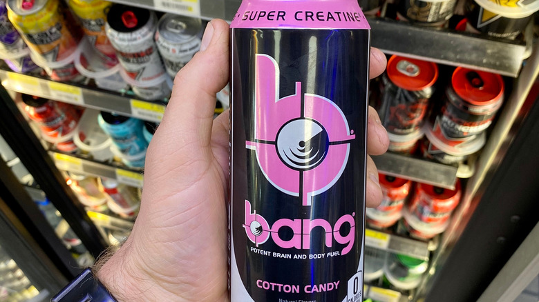 Hand holding Bang energy drink