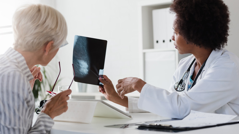 Doctor holding patient X-ray