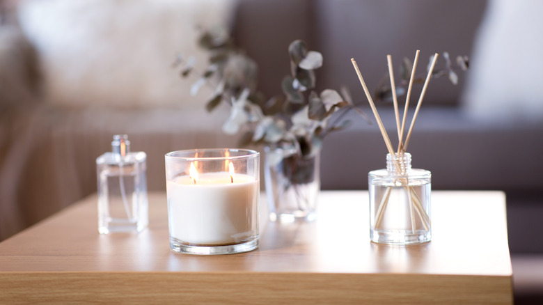 burning candle on a living room table 