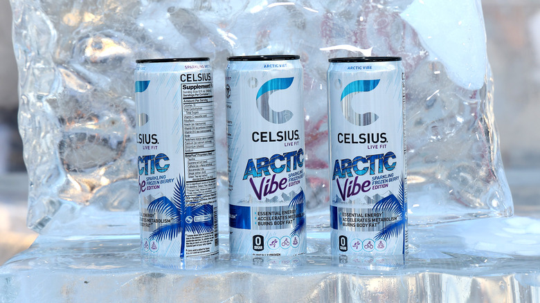 three Celsius energy drinks on ice