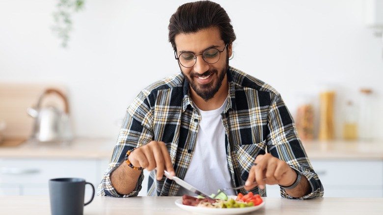 man eating healthy meal at home