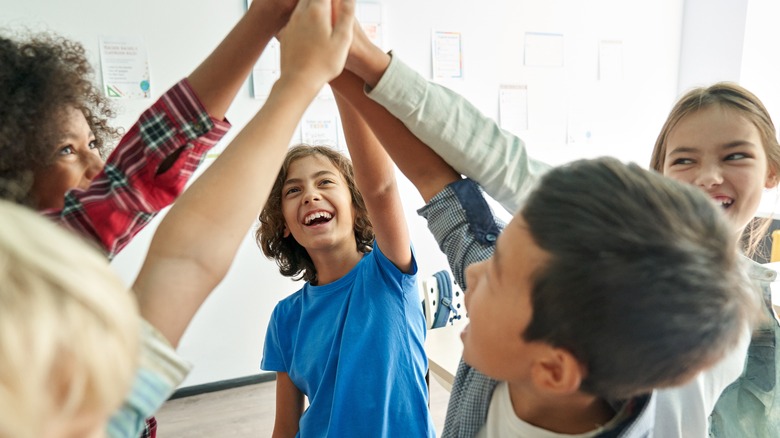 Children having a group high-five