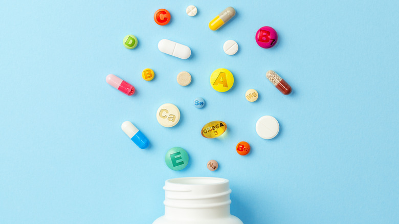 vitamin tablets on blue background