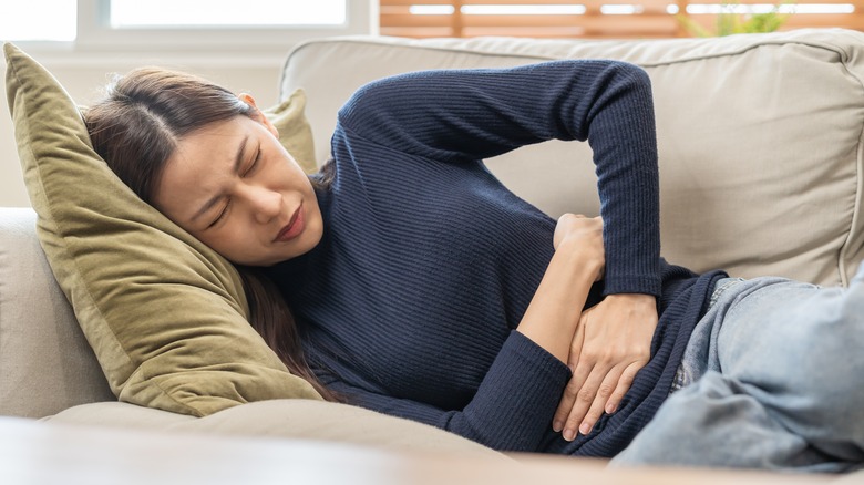 young woman with stomach pain