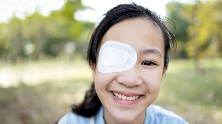 Woman with a patch over her eye