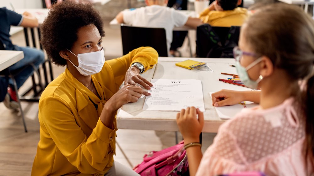 Teacher and students with face masks