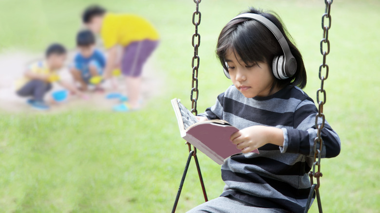 introverted boy on playground