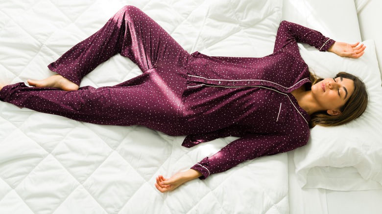 Woman sleeping in silk Pjs