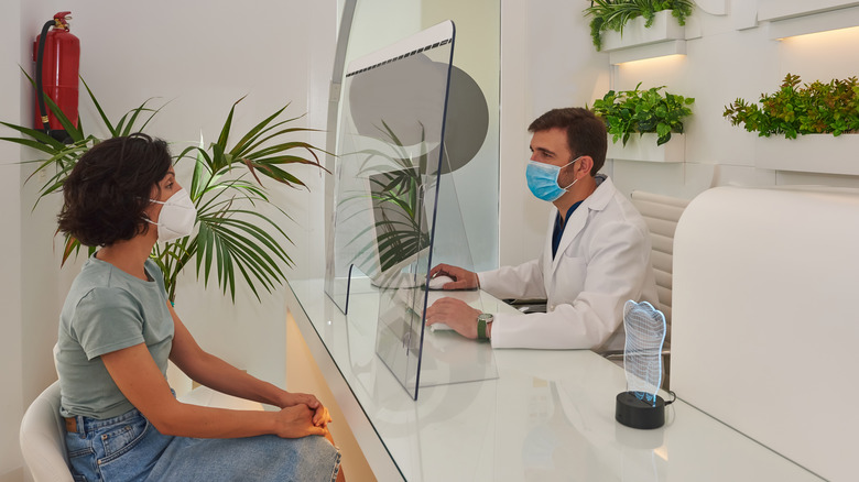 woman at doctor's reception desk