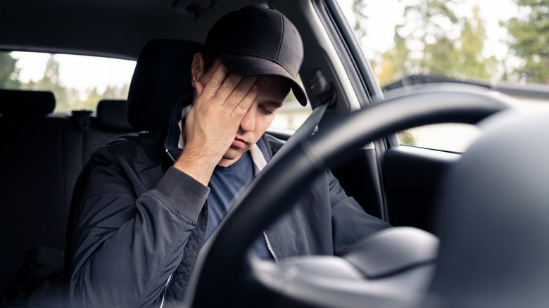 Drowsy man driving automobile