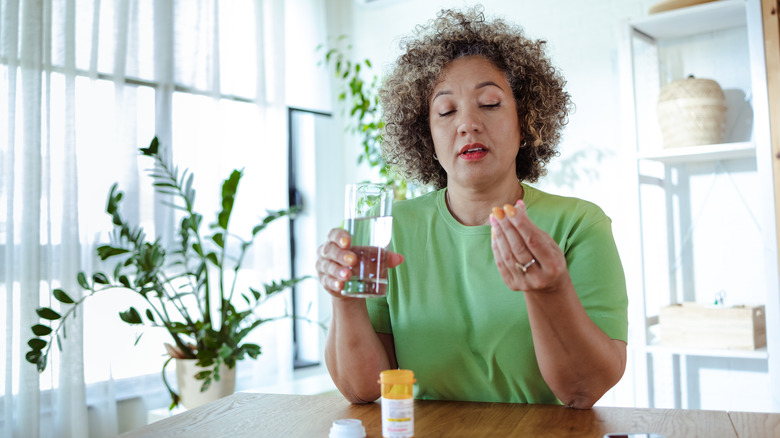 Woman taking medication