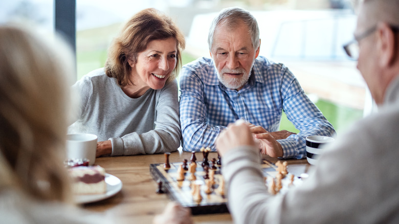 older couples playing chess