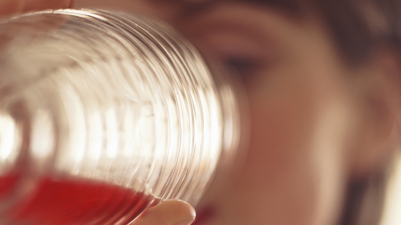 woman drinking cranberry juice