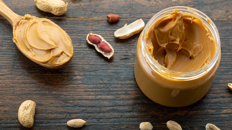 Jar and spoonful of peanut butter