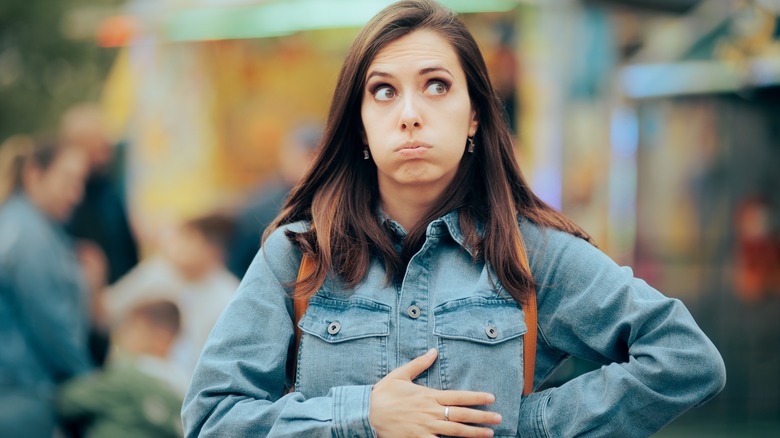 woman with indigestion holding her stomach