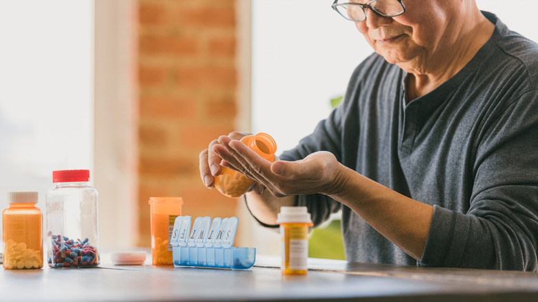 Man organizing his medications