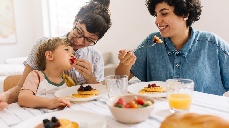 A family eats breakfast together