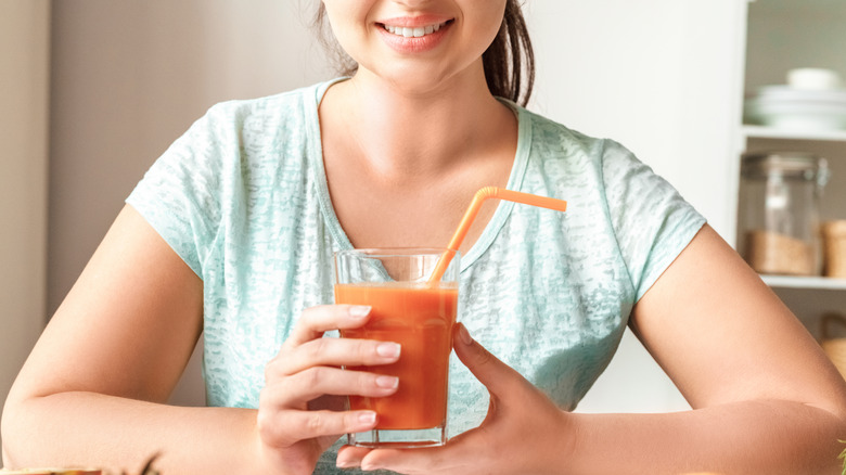 Woman holding smoothie