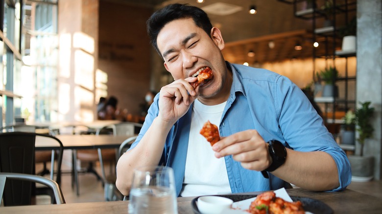 Person eating wings