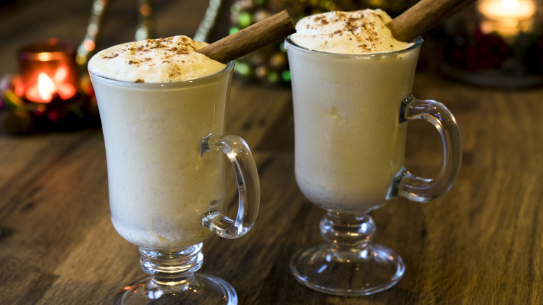 two eggnog cocktails on wooden table