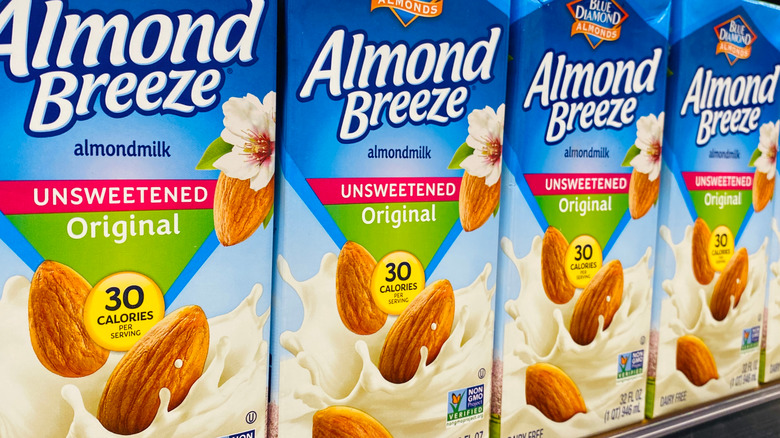 almond breeze cartons on grocery shelf