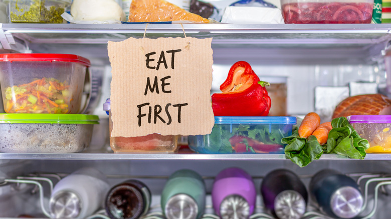 "Eat me first" sign inside home refrigerator