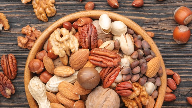 nuts in bowl on wooden surface