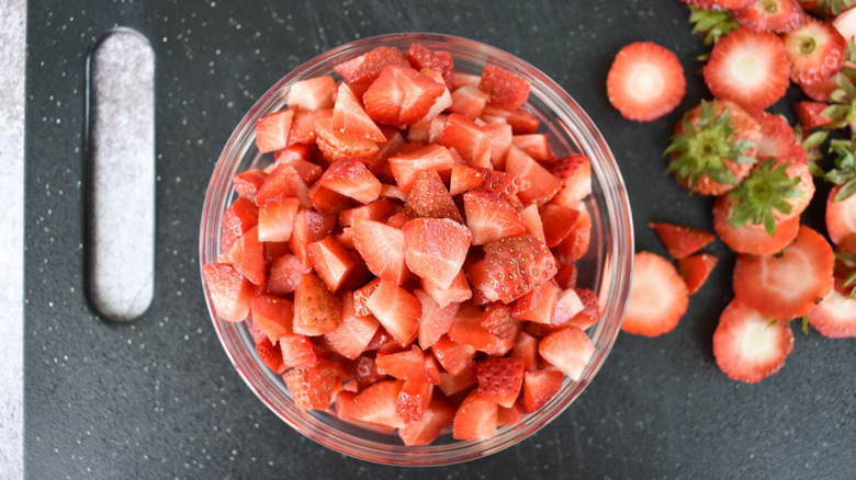 chopping strawberries