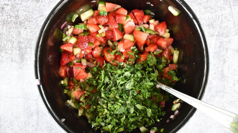 Chopping cilantro and mint for Strawberry Salsa 