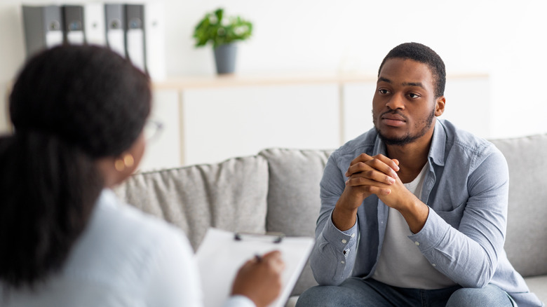 Man talking to therapist